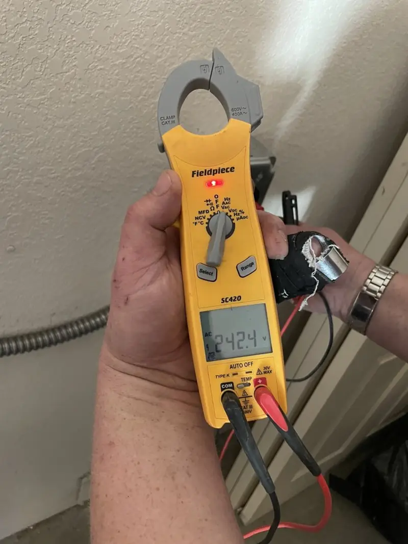 Voltage testing with clamp meter during Recessed Lighting Installation in Chazy